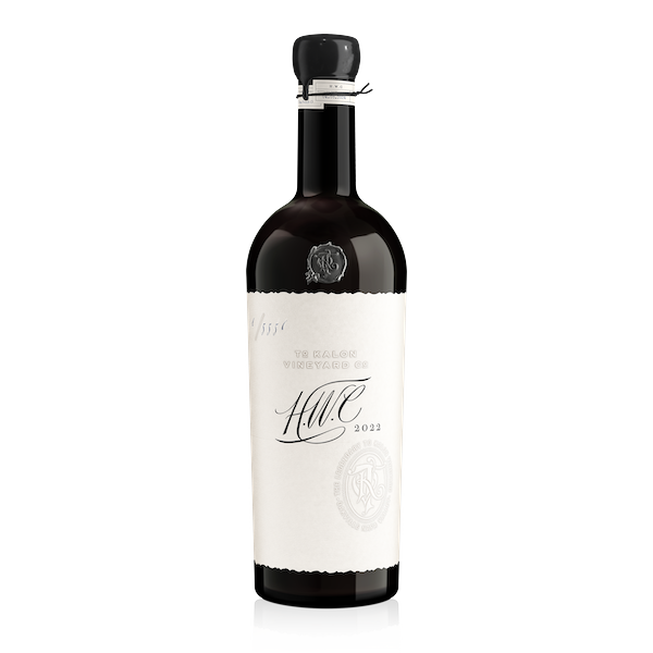 A bottle of 2022 H.W.C. Cabernet Sauvignon wine with a white label on a clear background.