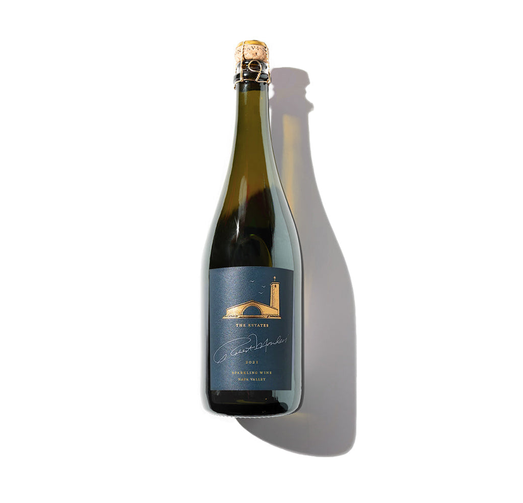 Bottle of sparkling wine against a white background