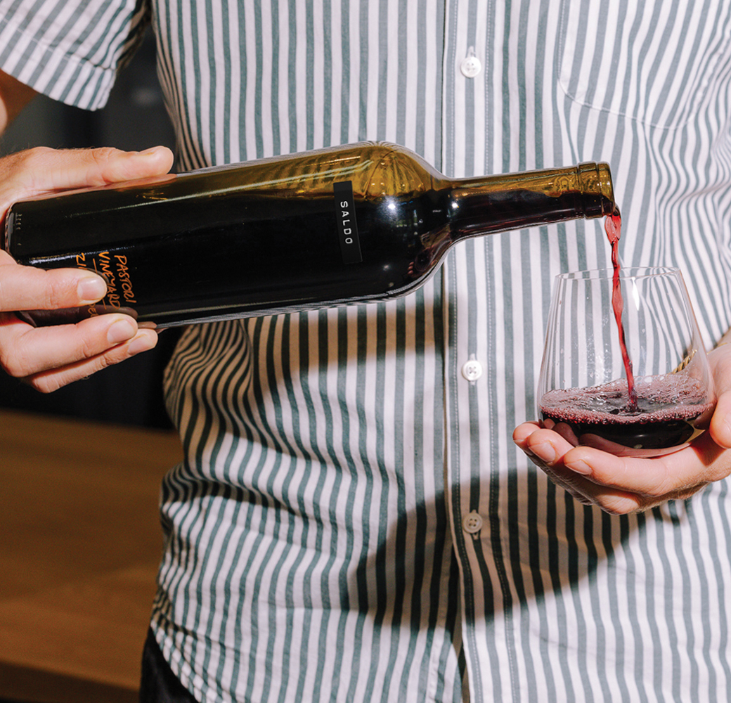 Bottle of Saldo Pastori Vineyard Zinfandel being poured into a glass