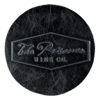 The Prisone Logo black leather coaster on a blank background