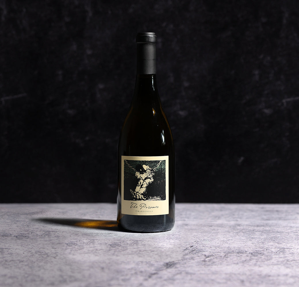 A Bottle Of  2022 The Prisoner Chardonnay Carneros Wine On A Gray Background